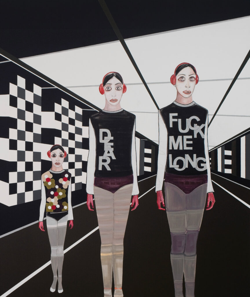 Three women in red headphones and red hands stand in a corridor; text on two shirts reads "dear" and "fuck me long".